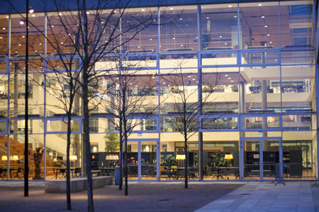View of the facade of a modern office building in the evening.