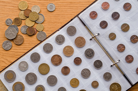 Page of numismatics album with different coinsの写真素材