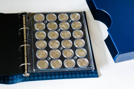 Large album for collectible coins in capsulesの写真素材