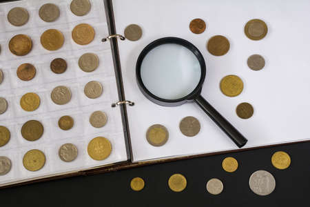 Page of numismatics album with different coinsの写真素材