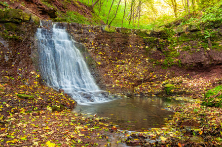 Beautiful waterfall in autumn forest, Rusyliv waterfalls, Ukraineの写真素材