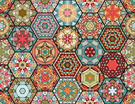 Colorful patchwork pattern in ethnic style. Hexagonal ceramic tiles with bright ornament. Seamless vector design.のイラスト素材