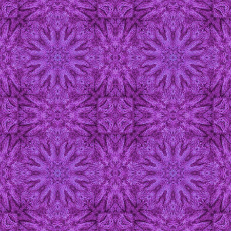 Decorative seamless pattern with knitted ornament in purple colorsの写真素材