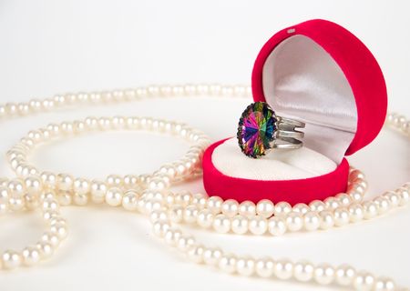 Pearls and expensive ring against white backgroundの写真素材