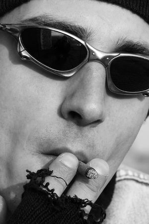 Man smoking a cigarette in black and white