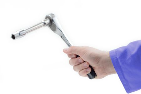 Mechanic holding a wrench against white backgroundの写真素材