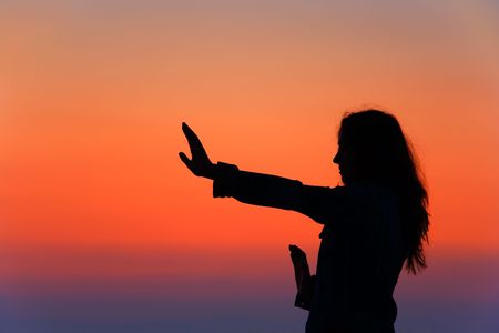 A young woman exercising at the beachの写真素材
