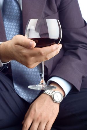 A close up of a classy businessman with a drinkの写真素材