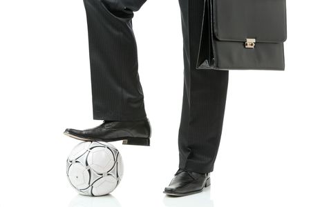 Businessman with a soccer ballの写真素材