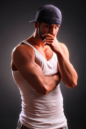 Handsome male against black background