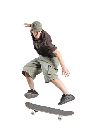 A skateboarder jumping isolated on a white backgroundの写真素材