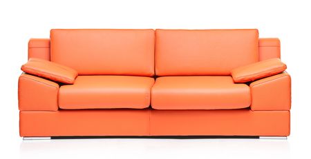 Image of a modern orange leather sofa over white backgroundの写真素材