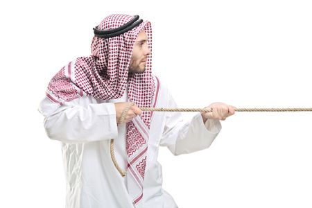 An Arab person pulling a rope isolated on white backgroundの写真素材