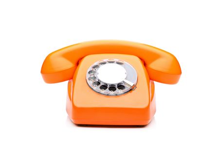 An old orange phone isolated on white backgroundの写真素材