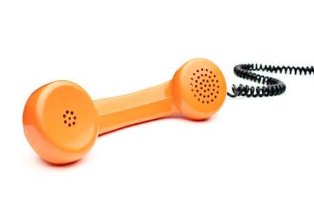Old orange telephone tube isolated on whiteの写真素材
