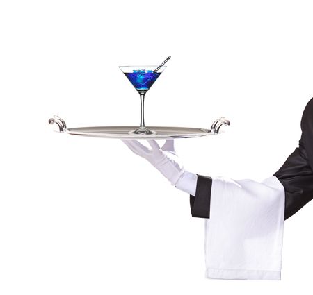 A butler holding a tray with cocktail blue curacao on it isolated on whiteの写真素材