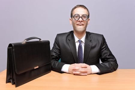 Nerdy businessman in the officeの写真素材