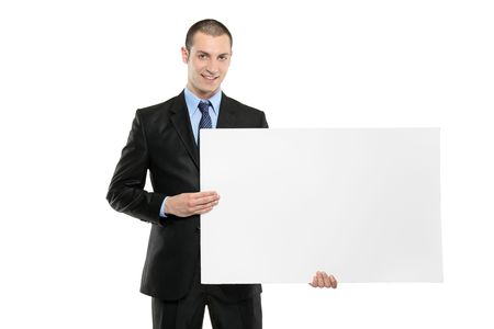 A young businessman holding a white blank  card, good space for writing or placing an imageの写真素材
