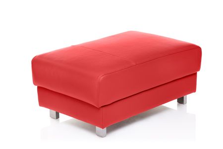 A view of a red footstool isolated against white backgroundの写真素材