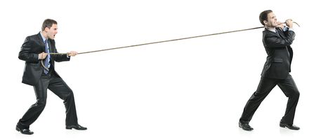Two businessmen pulling a rope isolated on white backgroundの写真素材