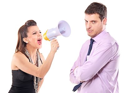 Young couple quarreling isolated against white background の写真素材
