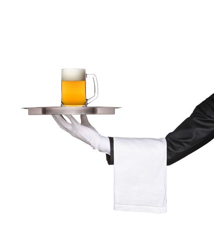 Butler holding a tray with a beer glass on it isolated on whiteの写真素材