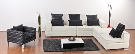 A studio shot of modern white sofa and a chairの写真素材