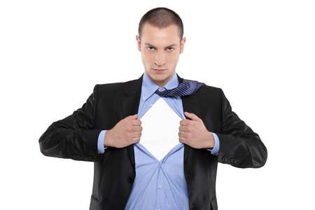 Superhero businessman opening blue shirt Blank white t-shirt underneath provides excellent copy space for your image, text or logoの写真素材