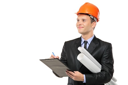 Young construction worker with helmet writing down notes isolated on white backgroundの写真素材
