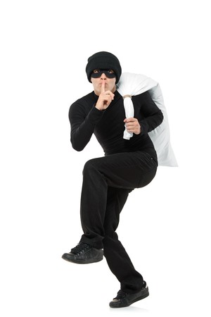 Criminal running away carrying a bag isolated against white backgroundの写真素材