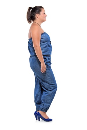 Full length portrait of a female standing in a line against white backgroundの写真素材