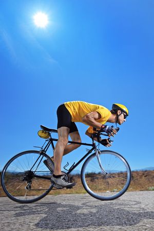 A biker riding a bike on an open road in Macedoniaの写真素材