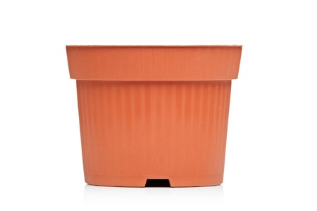 A view of an empty brown flowerpot isolated on white backgroundの写真素材