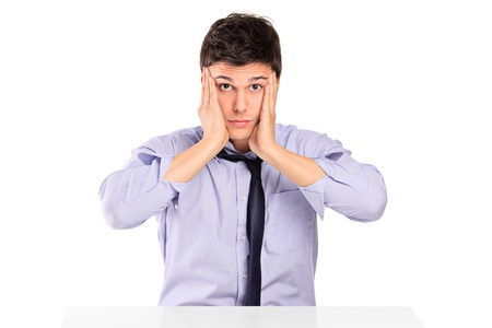 A portrait of a confused businessman isolated against white backgroundの写真素材