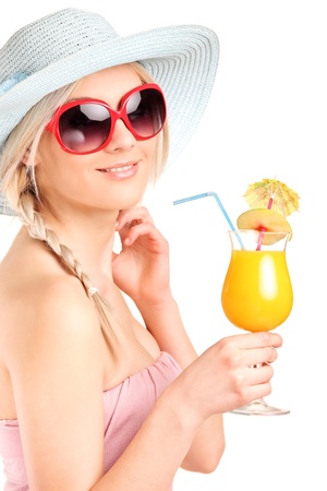 Attractive woman with sunglasses drinking a cocktail isolated on white backgroundの写真素材