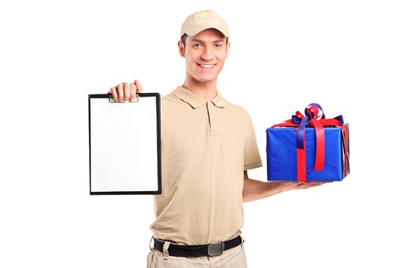 Delivery person delivering a gift box and holding a clipboard isolated on white backgroundの写真素材