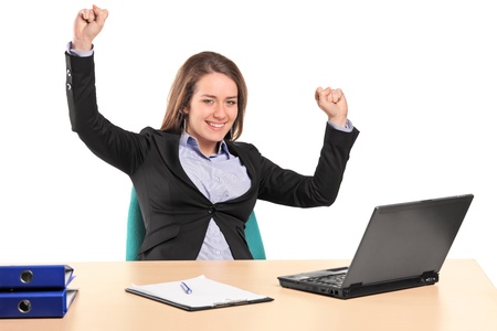 A young happy businesswoman in her office isolated on white backgroundの写真素材