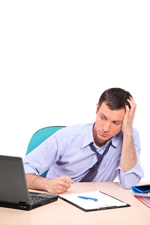 A desperate businessman in his office isolated on white backgroundの写真素材