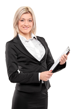 A smiling businesswoman holding documents isolated on white backgroundの写真素材