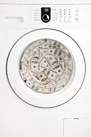 Close up of money in washing machine の写真素材