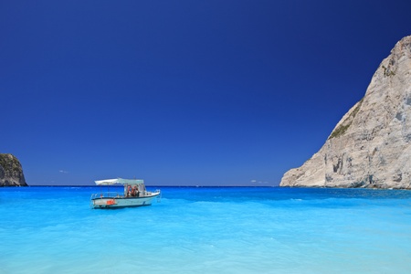 Boat anchored on Navagio beach (also known as shipwreck beach), Zakynthos island, Greeceの写真素材