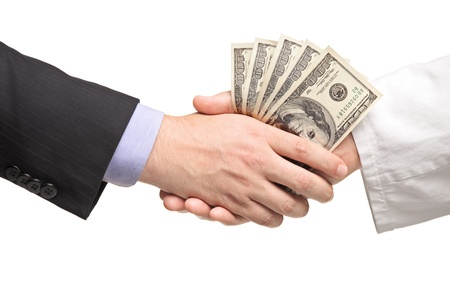 Businessman with money handshaking with doctor isolated on white backgroundの写真素材