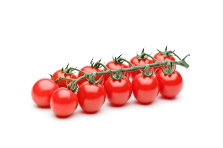 Close-up of fresh ripe cherry tomatoes isolated on white backgroundの写真素材