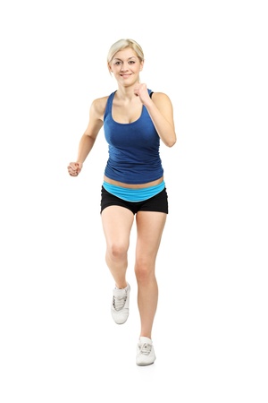 Full length portrait of a female runner isolated on white backgroundの写真素材