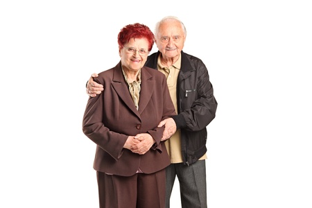 Smiling senior couple posing isolated against white backgroundの写真素材