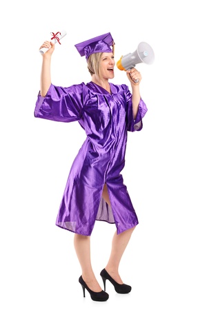 Full length portrait of a graduate student holding her diploma and announcing isolated on white backgroundの写真素材