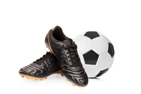 Football shoes and a football isolated on white backgroundの写真素材