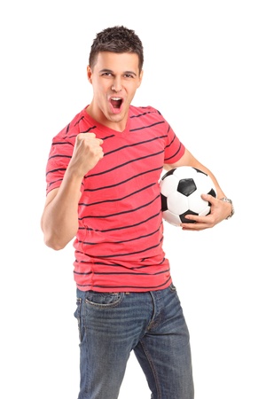 Young man cheering and holding a football on white backgroundの写真素材