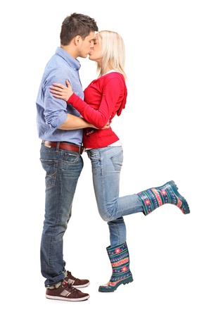 A view of a loving couple kissing isolated on white backgroundの写真素材