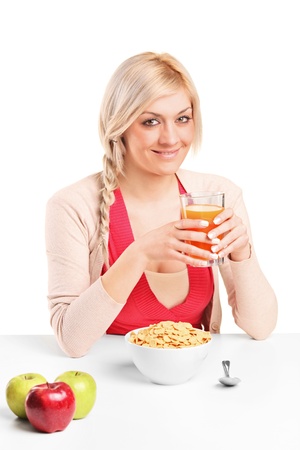 A young female during a breakfast isolated on white backgroundの写真素材